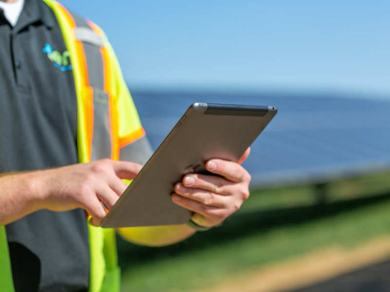 A person holding an iPad.